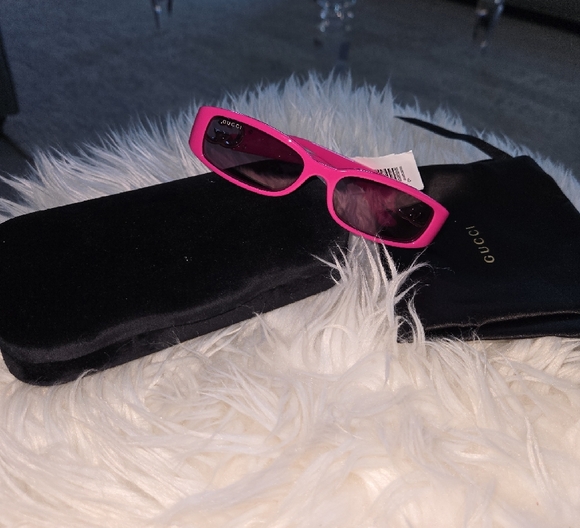 Vibrant Pink Modern Sunglasses with UV Protection. Gucci 